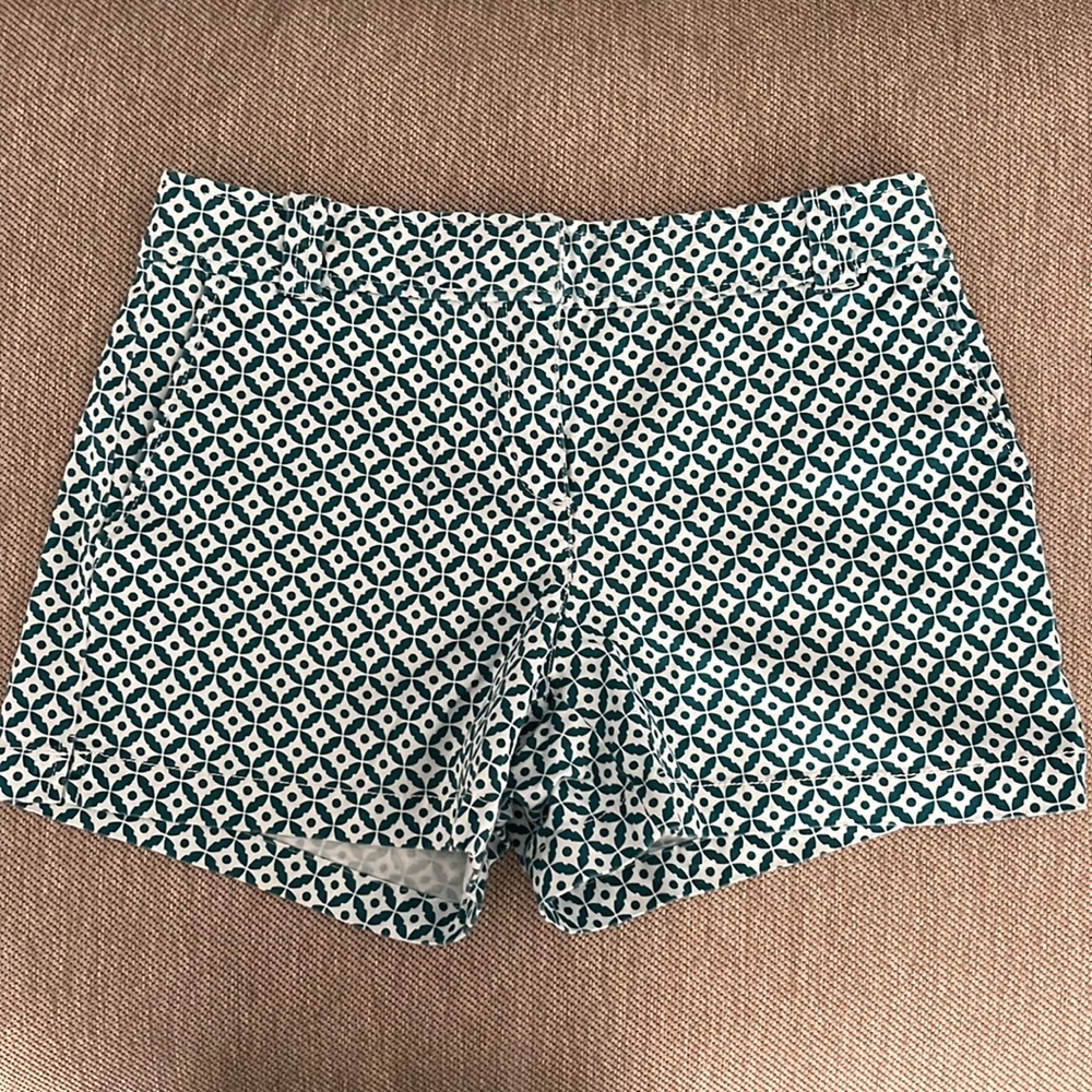 green & white pattern shorts